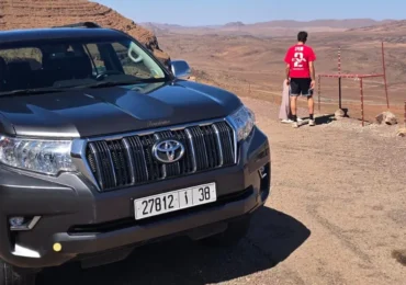 Private 4x4 tour vehicle parked at scenic High Atlas mountain viewpoint
